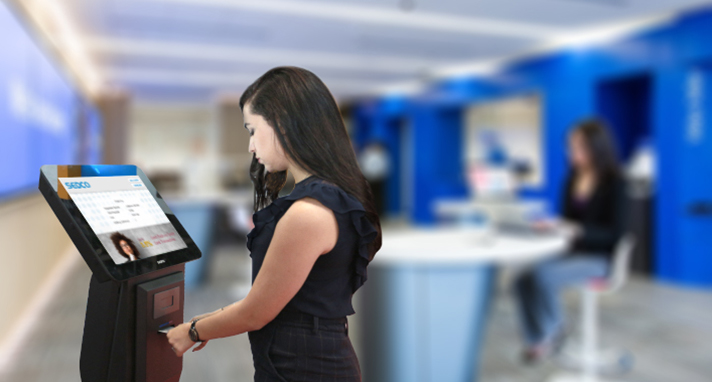 Women using SEDCO's ticketing kiosk
