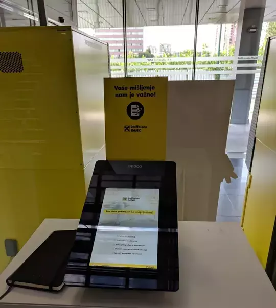 SEDCO's customer feedback device at Raiffeisen bank branch